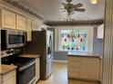 Efficient kitchen with stainless steel appliances and cabinetry, offering a practical cooking environment at 3358 Stonecrest Ct, Atlanta, GA 30341