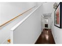 Bright hallway with hardwood floors, a staircase, and access to the bathroom offers a clean design at 920 Memorial Se Dr # 11, Atlanta, GA 30316