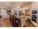 Spacious kitchen with a granite island, stainless steel appliances, and pendant lighting at 2448 Gatebury Cir, Atlanta, GA 30341