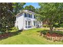 Lovely two-story home with a well-kept lawn and mature trees providing shade and privacy at 4909 Glenwhite Dr, Duluth, GA 30096