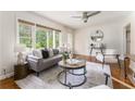 Bright living room features hardwood floors, a large window, and a neutral color palette at 2685 Flagstone Se Dr, Atlanta, GA 30316