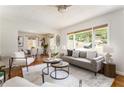 Inviting living area with a gray sofa, stylish decor, and seamless flow into the adjacent dining space at 2685 Flagstone Se Dr, Atlanta, GA 30316