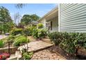 Beautiful walkway and lush landscaping lead to the quaint, covered front porch at 865 Ashland Ne Ave, Atlanta, GA 30307