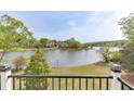 Scenic lake view from a railed balcony, showcasing waterfront living and natural beauty at 3390 Mill Valley Dr, Dacula, GA 30019