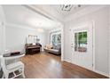 Bright living room with hardwood floors, a piano, and a comfortable seating area at 461 Timberleaf Rd, Canton, GA 30115