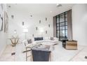Inviting lobby with modern furniture, large windows with views, and chic interior design at 3040 Peachtree Nw Rd # 815, Atlanta, GA 30305