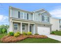 Attractive two-story home with brick and siding exterior, featuring a well-kept lawn and an attached two-car garage at 3135 Ellenton Dr, Lithia Springs, GA 30122