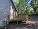 View of a wooden deck with railing, perfect for outdoor entertaining, overlooking the backyard at 3948 Valley Brook Rd, Snellville, GA 30039