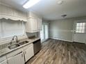 Kitchen featuring granite countertops, stainless steel appliances, and wood flooring at 1263 Shoreham Dr, Atlanta, GA 30349