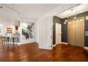 Elegant entrance hall with hardwood floors, an Eiffel Tower picture and a stylish elevator at 20 10Th Nw St # 2003, Atlanta, GA 30309