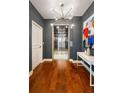 Modern hallway featuring sleek hardwood floors, contemporary lighting, and stylish elevator at 20 10Th Nw St # 2003, Atlanta, GA 30309