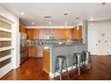 Modern kitchen featuring stainless steel appliances, ample storage, and a convenient breakfast bar at 20 10Th Nw St # 2003, Atlanta, GA 30309