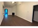 Spacious living room featuring vaulted ceilings, dark hardwood flooring and fireplace at 210 Park Place Trl, Social Circle, GA 30025