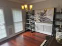 Charming dining area featuring a stylish chandelier, lovely art, and a keyboard at 2122 Riverbirch Ct, Lawrenceville, GA 30044