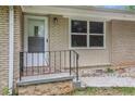 Close-up of front entrance showing brick detail and black iron railing at 3367 Misty Valley Rd, Decatur, GA 30032