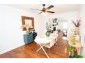 Cozy dining area featuring hardwood floors, stylish furniture, and seamless flow to an adjacent living area at 3404 Vinings North Se Trl, Smyrna, GA 30080