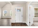 Welcoming entryway featuring a bright white front door and views of the adjacent rooms at 8230 Dawson View Way, Cumming, GA 30028
