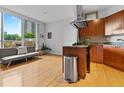 Bright kitchen featuring stainless steel exhaust, granite countertops and modern wood cabinets at 2626 Peachtree Nw Rd # 606, Atlanta, GA 30305
