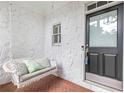 Cozy front porch featuring a swing and textured stone wall detail at 2773 Brookgrove Se Ln, Atlanta, GA 30339