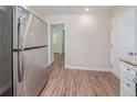 Spacious kitchen featuring stainless steel refrigerator with a view to an adjacent room at 3497 Glensford Dr, Decatur, GA 30032