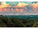 Scenic view of the city skyline surrounded by lush greenery and dramatic clouds at 4100 Paces Se Walk # 4306, Atlanta, GA 30339