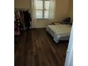 Inviting bedroom with hardwood floors and a large window for natural light at 4173 Stillwater Dr, Duluth, GA 30096