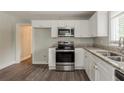 Modern kitchen showcasing stainless steel appliances, granite countertops, and ample cabinet space at 2465 Hogan Rd, Atlanta, GA 30344
