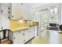 Cozy kitchen featuring bright countertops, cabinets, and ample natural light at 1861 Ardmore Nw Rd, Atlanta, GA 30309