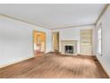 Bright living room features hardwood floors, fireplace, and built-in shelves at 1861 Ardmore Nw Rd, Atlanta, GA 30309