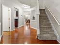 Welcoming entryway with hardwood floors and a staircase leading to the upper level at 2060 Ellison Nw Way # 11, Kennesaw, GA 30152