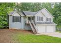 Charming home with a two-car garage, front stairs, and well-maintained landscaping at 2326 Westland Way, Acworth, GA 30102