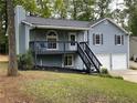 Charming two-story home with a welcoming front porch and well-maintained landscaping at 214 Sweetwater Cir, Powder Springs, GA 30127