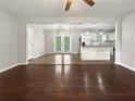 Open concept living space with hardwood floors, and a seamless transition to the kitchen at 3653 Mecklinburg Pl, Decatur, GA 30032