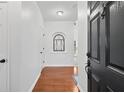 Inviting foyer with hardwood floors and neutral walls provides a warm welcome into the home at 449 Highlands Loop, Woodstock, GA 30188