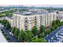 An aerial view of an upscale apartment building with beautiful landscaping at 711 Cosmopolitan Ne Dr # 123, Atlanta, GA 30324