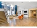 Spacious lobby boasts high ceilings, modern chandelier, cozy seating, fireplace and stylish staircase at 711 Cosmopolitan Ne Dr # 123, Atlanta, GA 30324