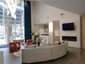 Bright lobby with modern furniture, fireplace, and large windows at 711 Cosmopolitan Ne Dr # 123, Atlanta, GA 30324