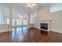 Bright and airy living room with hardwood floors, fireplace, and ceiling fans at 1022 Pecan Grove Pl, Lawrenceville, GA 30046