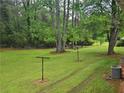 Expansive backyard with lush green grass and mature trees, offering a serene and private outdoor space at 2555 Angus Sw Ct, Marietta, GA 30008