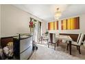 Bright dining room with natural light, a modern table setting, and stylish décor at 3955 Old Fairburn Sw Rd, Atlanta, GA 30331