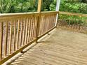 A close up of the porch, featuring railings and floorboards at 75 Davis Mill Dr, Dallas, GA 30157