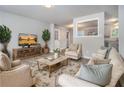 Cozy living room featuring stylish furniture, hardwood floors, and decor enhancing the home's appeal at 898 Doeskin Nw Dr, Conyers, GA 30012