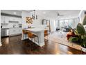 Beautiful open concept living room and kitchen with breakfast bar and stainless steel appliances at 215 Piedmont Ne Ave # 1509, Atlanta, GA 30308