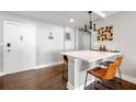 This living room has a bar area with two orange chairs and faces the main entrance at 215 Piedmont Ne Ave # 1509, Atlanta, GA 30308