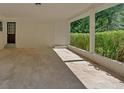 Attached carport featuring brick walls and ample space at 3951 Lindley Dr, Powder Springs, GA 30127