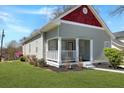 Charming home with lush lawn, front porch, and well-maintained landscaping at 3087 Semmes St, Atlanta, GA 30344
