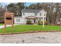 Two-story home with a manicured lawn, attractive curb appeal, and a modern address sign at 2206 Loring Ct, Decatur, GA 30032