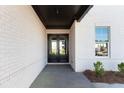 Inviting front entrance with double doors and white brick facade at 750 Garden Reserve Ln, Alpharetta, GA 30005