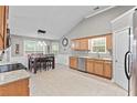 Bright eat-in kitchen boasts stainless steel appliances and a charming dining area at 20 Madison Ct, Covington, GA 30016