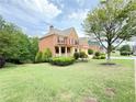 Beautiful brick home with manicured landscaping, a two-car garage, and a welcoming front porch at 3500 Millwater Xing, Dacula, GA 30019
